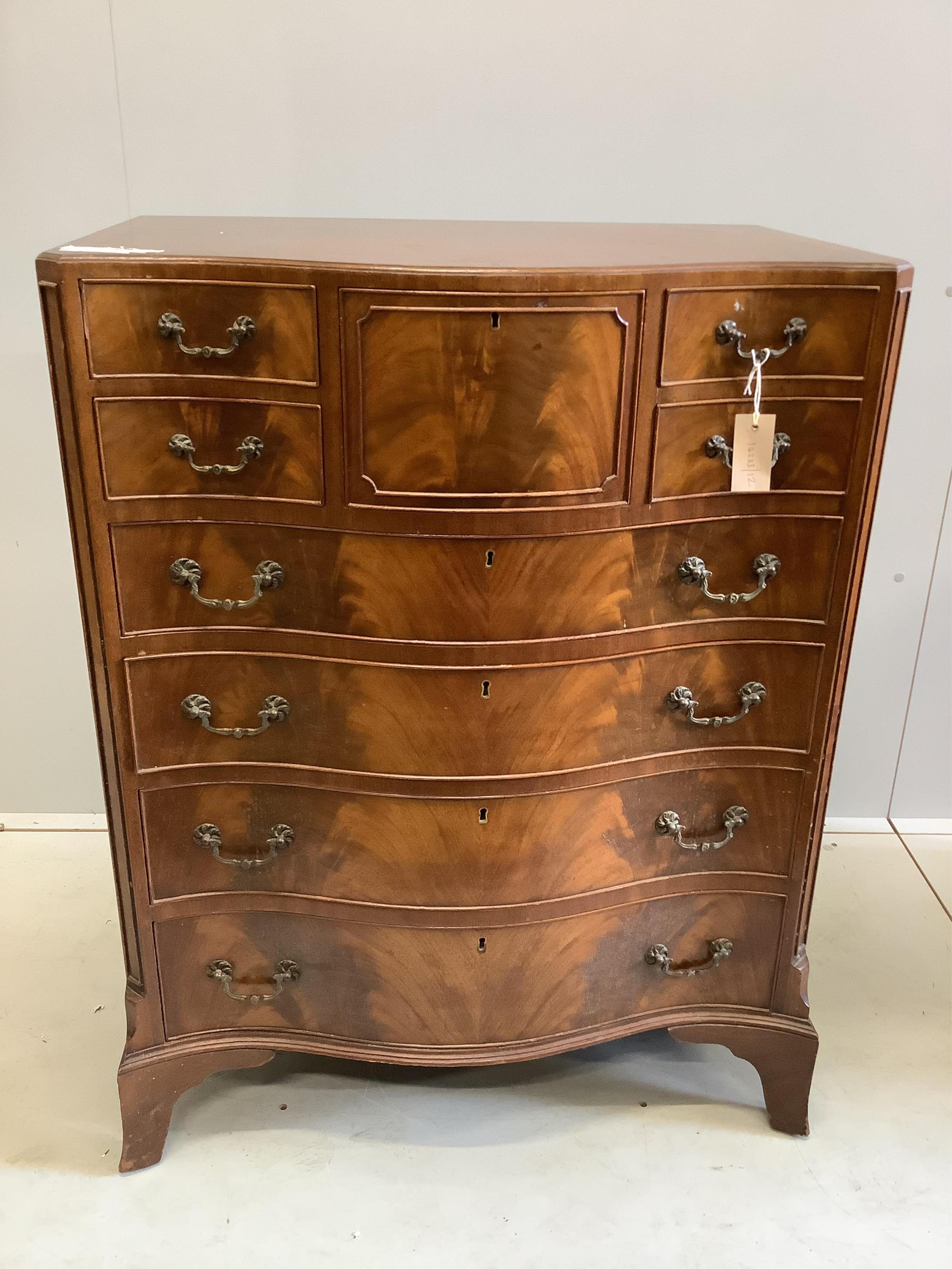A reproduction George III style mahogany serpentine chest of nine drawers, width 76cm, depth 51cm, height 98cm. Condition - fair